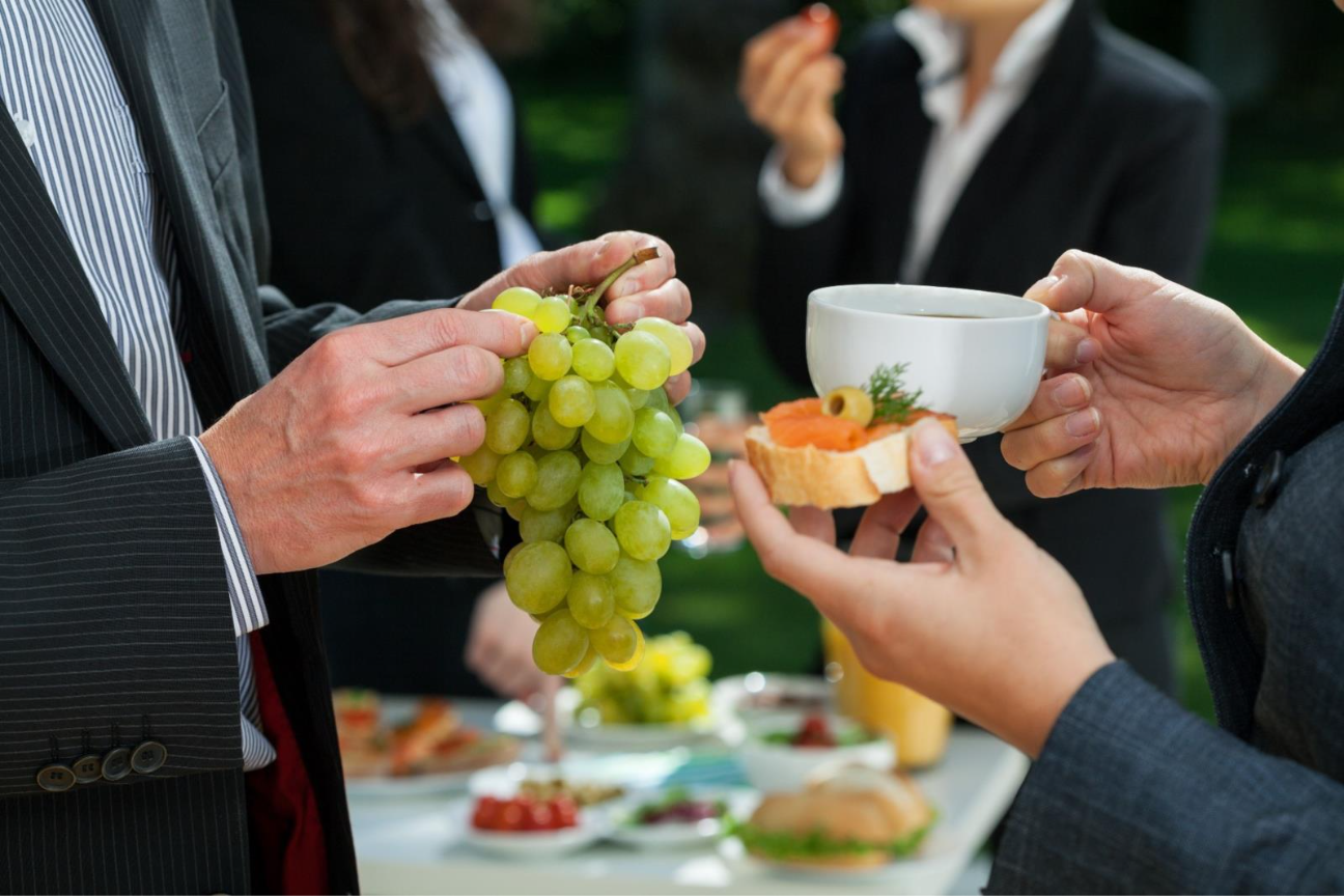 A group of people holding grapes and a cup of coffee  AI-generated content may be incorrect.